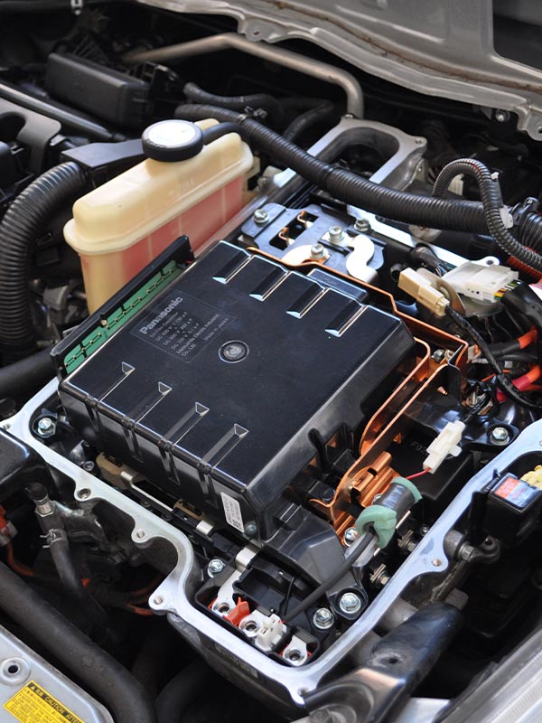 image of Masaki Auto worker repairing hybrid car battery
