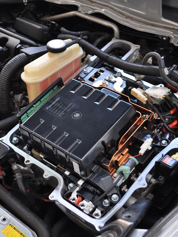 image of Masaki Auto worker repairing hybrid car battery