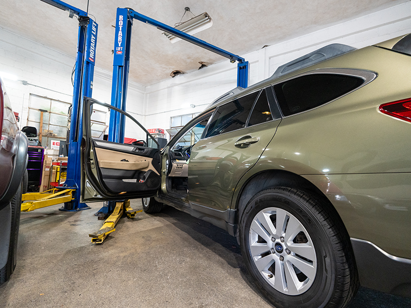 image of vehicles in Masaki's garage getting a safety inspection